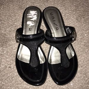 Black sandals with a small wedged heel